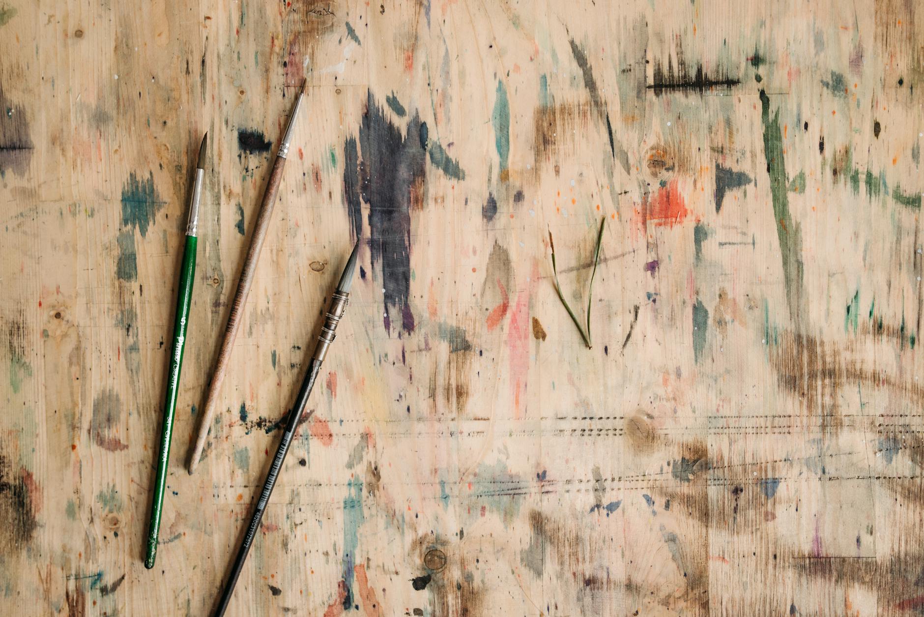Artist's brushes and painting supplies in studio
